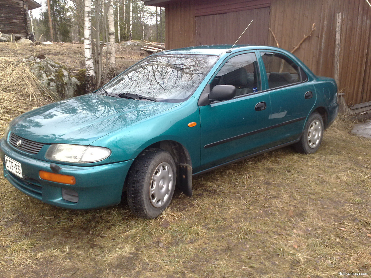 Mazda familia книга